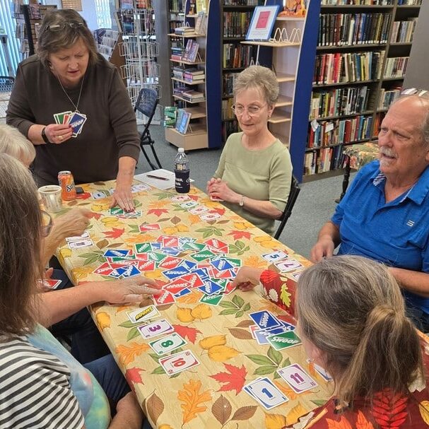 Group of senior citizens playing Uno - Red Bud Senior Link